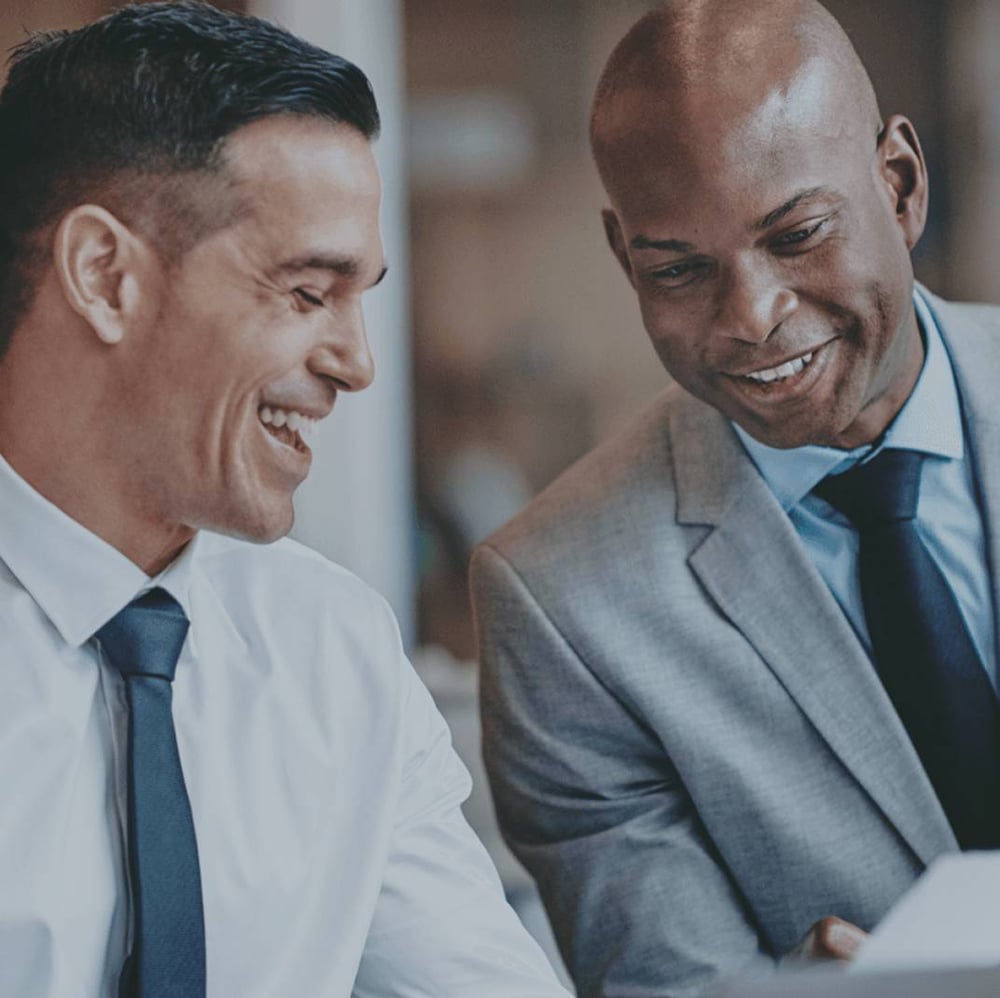 two business men looking at document