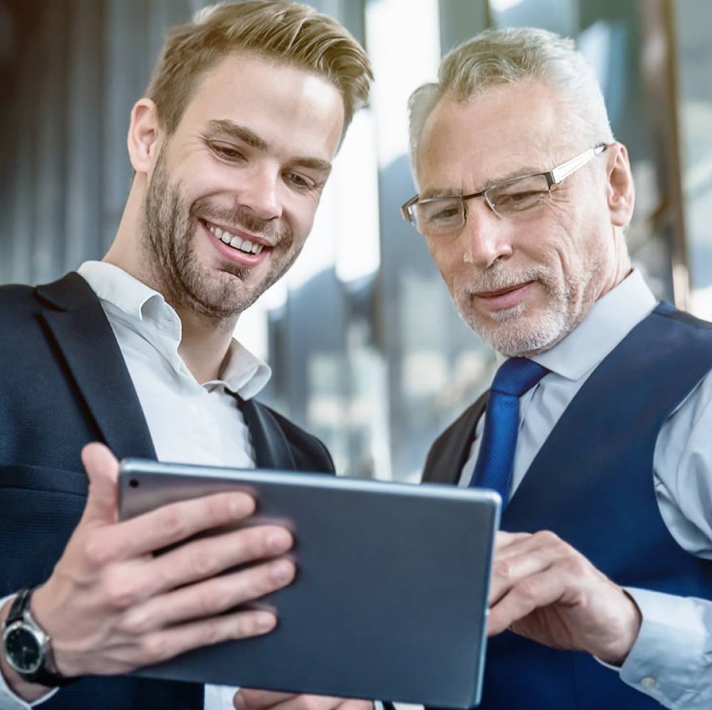 two business men looking at tablet-1